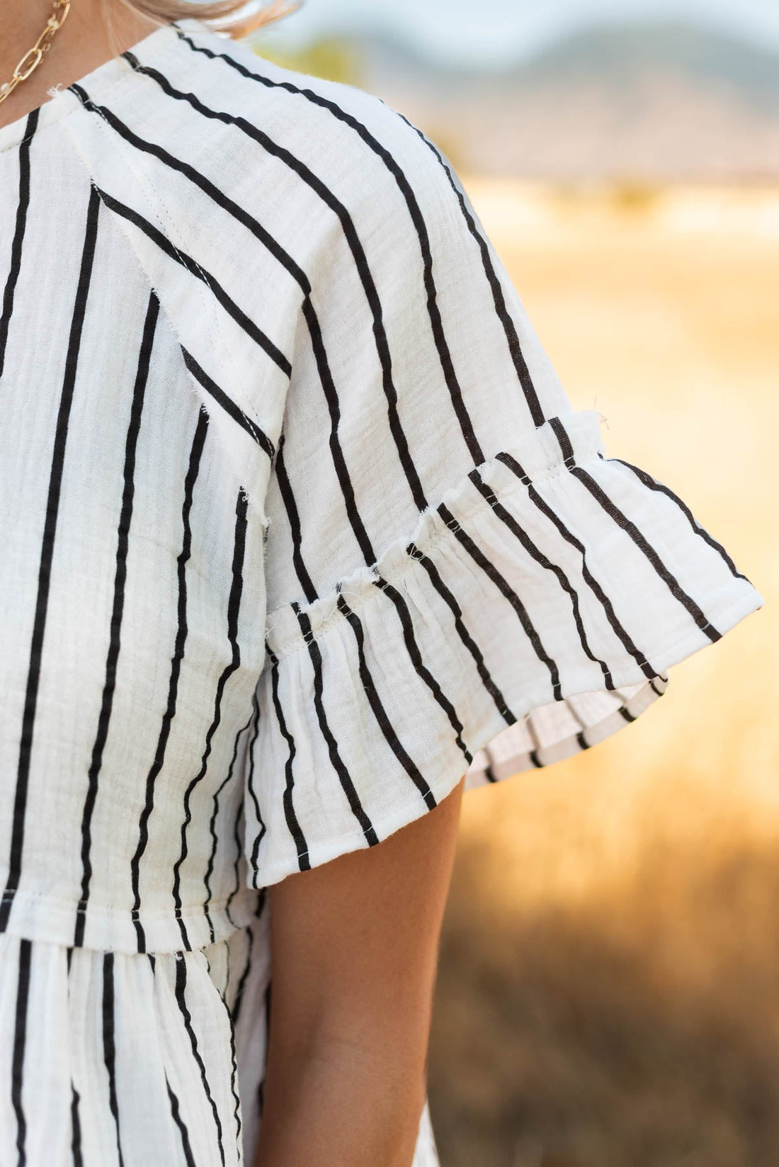 Brynn Black Striped Peplum Top